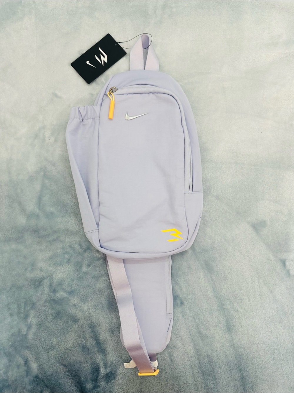 Nike Lavender Sling Bag with White Swoosh and Yellow Accents
